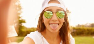 Girl happy with the benefits of brushing her tongue