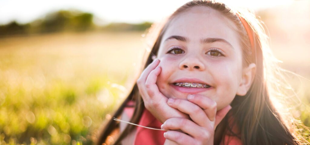 child learns Braces vs Invisalign pros and cons