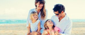 family on the beach talks about Invisalign buttons vs. attachments